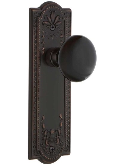 Meadows Style Door Set with Black Porcelain Knobs in Timeless Bronze.